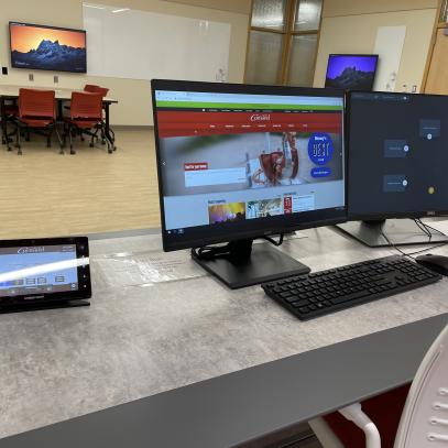 Image of instructor station and desks in active learning classroom at SUNY Cortland Rm 209